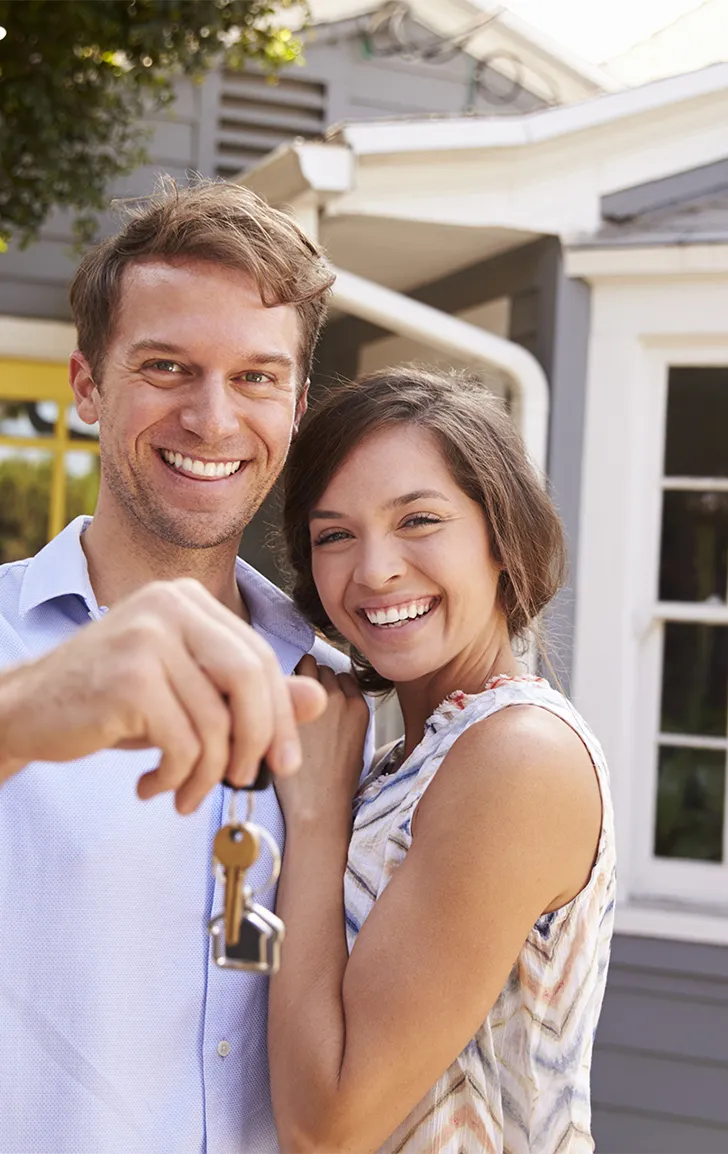 happy couple with keys